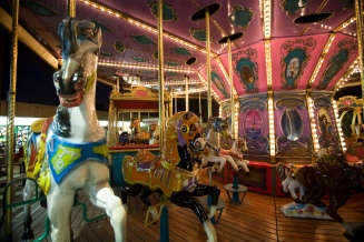 Woden horses. Merry-go-round Carrousel at the EUR Fun Fair. Rome, Italy